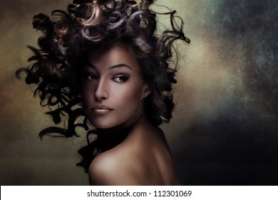 beautiful black young woman beauty shot with hair in motion