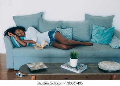 Beautiful Black Young Woman Sleeping In The Sofa 
