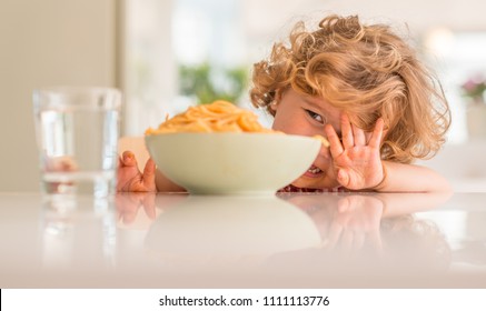 Beautiful Blond Child Eating Spaghetti With Hands Crying With Tantrum At Home.