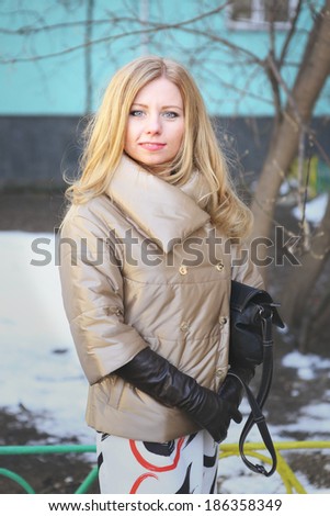 beautiful blond girl on the street background