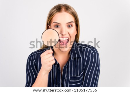 beautiful blond girl with perfect skin commercial face type holding magnifier beauty skin concept, size plus model