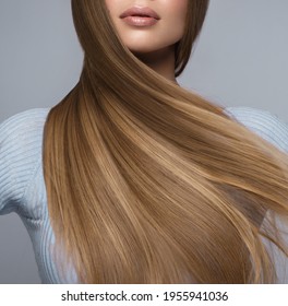 Beautiful blond girl with a perfectly smooth hair, and classic make-up. Beauty face and hair. - Shutterstock ID 1955941036