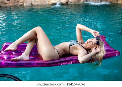 beautiful blond at her swimming pool
