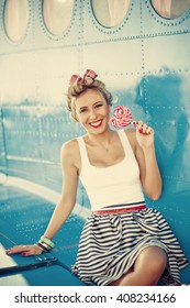 Beautiful Blond Pinup Girl Near Retro Airplane