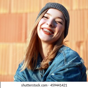 Beautiful Blond Teen Girl With Braces On Her Teeth Smiling