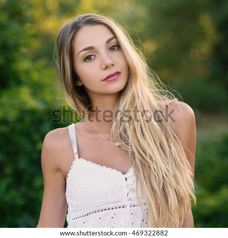 Beautiful Blond Teenager Portrait Outdoors In The Park Filtered Image Beautiful Blond Teenager Portrait Outdoors In The Park Filtered Image