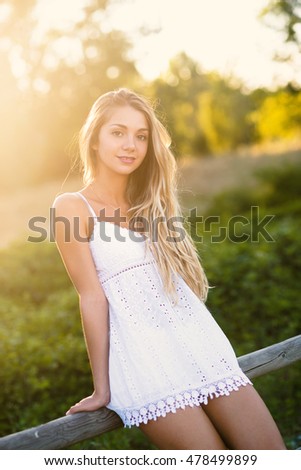 Beautiful Blond Teenager Portrait Outdoors In The Park Filtered Image With Flare Beautiful Blond Teenager Portrait Outdoors In The Park Filtered Image With Flare