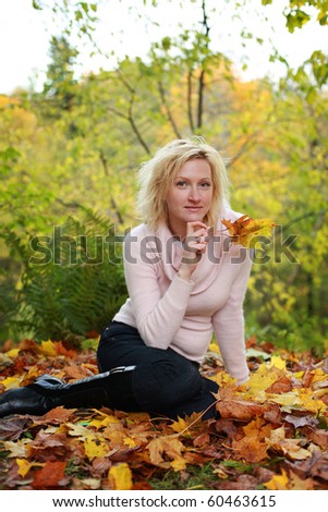 beautiful blond woman in autumn park