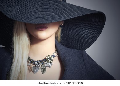 Beautiful Blond Woman in Black Hat. Close-up. Elegance Beauty Girl.Spring Shopping. Accessories. Lady in Jewelry - Powered by Shutterstock