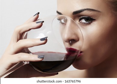 Beautiful Blond Woman Drinking Red Wine.make-up.red Lips.wineglass