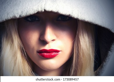Beautiful Blond Woman in Hood. With Red Lips. Box. Close-up Beauty Girl