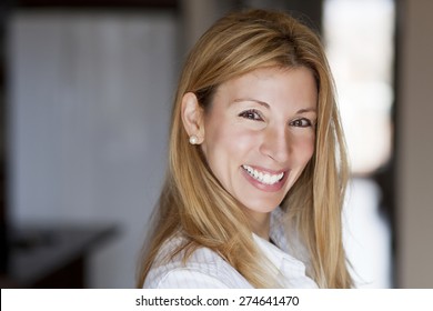 Beautiful blond woman smiling at the camera