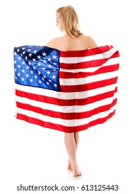 Beautiful blond woman wrapped only in an American flag