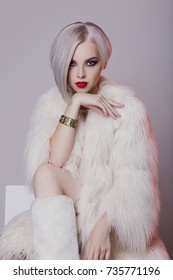 Beautiful Blond Young Woman In White Fur.winter Fashion.Beauty Sexy Model Girl With Bob Hair And Make-up