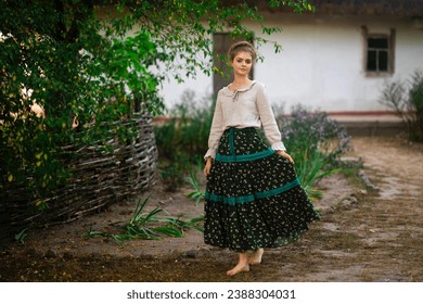 Beautiful  blonde braided girl in rural long dress posing in a village. Pretty young model in countryside art photo.  - Powered by Shutterstock