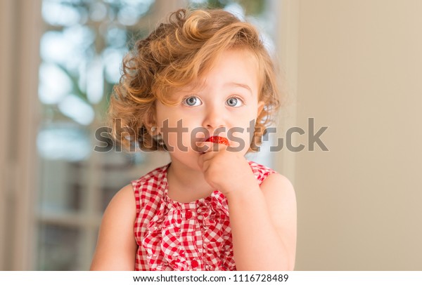 Beautiful Blonde Child Blue Eyes Eating Stock Photo Edit Now