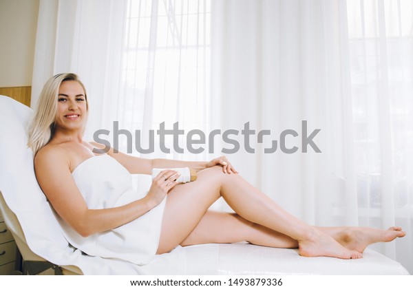 Beautiful Blonde Girl Doing Waxing Feet Stock Photo Edit Now