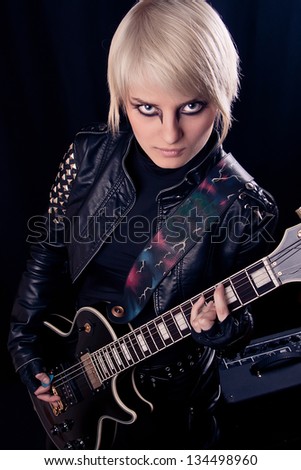 	Beautiful blonde girl with electric guitar
