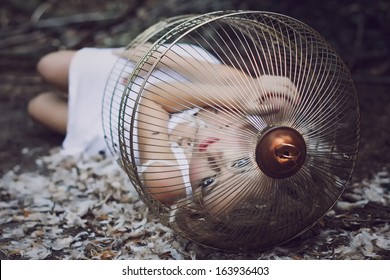 Beautiful Blonde Girl In A Golden Cage