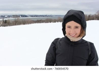 Beautiful Blonde Girl With Head Covered Standing Front In A Snowy Landscape, Closeup In Quebec, Montreal, Canada