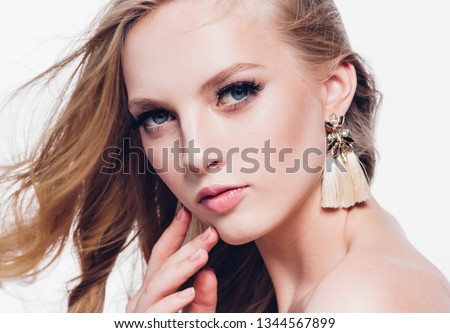 Beautiful blonde hair woman lashes beauty long curly hair isolated on white