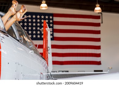 A Beautiful Blonde Model Poses With A Vintage WWII Aircraft