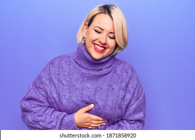 Beautiful blonde plus size woman wearing casual turtleneck sweater over purple background smiling and laughing hard out loud because funny crazy joke with hands on body.