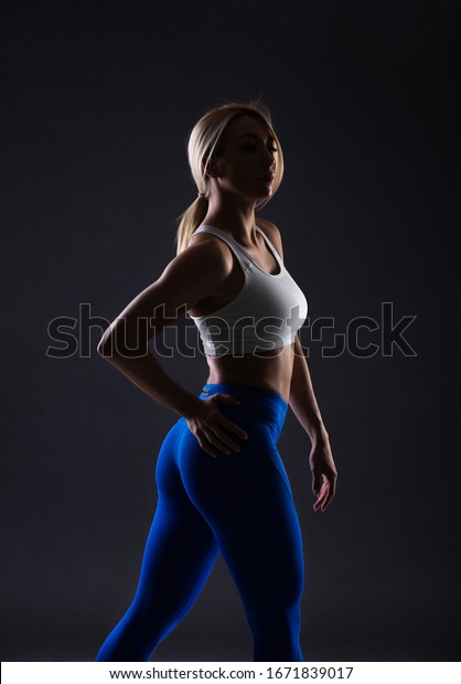 Beautiful Blonde Sexy Girl With Muscular Body Posing Fitness Concept