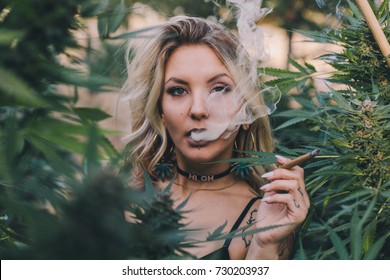 Beautiful Blonde Smoking Weed In A Garden