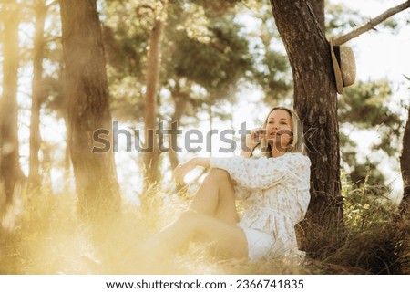 Similar – Woman with sunglasses touching over nature background