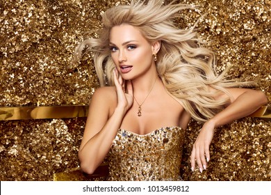 Beautiful Blonde Woman In Golden Flowers Garden