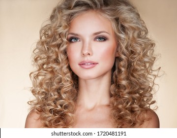 Beautiful Blonde Woman. Healthy Long Blond Hair. Curly Hair. Blond. Permed Hair. Afro Curls. Beauty Model Girl With Luxurious Hair.