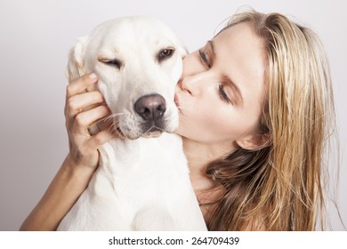 Beautiful Blonde Woman With Her Dog, Studio Shot. Horizontal