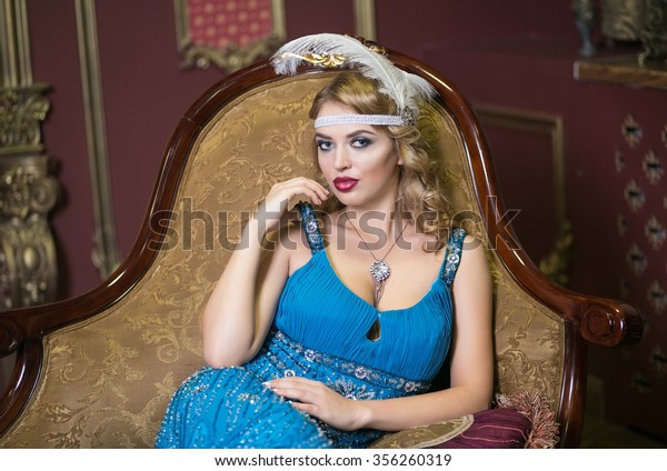 Beautiful blonde woman in historical clothing\
in the style of Art Nouveau in a luxurious interere Chicago 20s,\
the era of gangsters