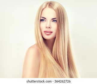 Beautiful Blonde Woman With Long, Healthy , Straight  And Shiny Hair.  Hairstyle Loose Hair 