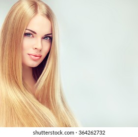 Beautiful Blonde Woman With Long, Healthy , Straight  And Shiny Hair.  Hairstyle Loose Hair 