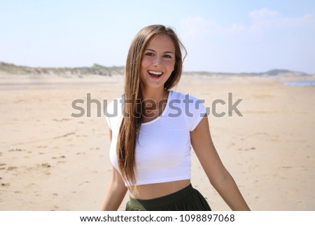 Similar – Young woman sits at the Baltic Sea beach