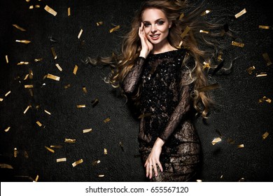 Beautiful Blonde Woman On Black Background With Confetti