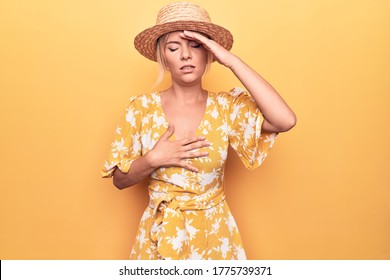 Beautiful Blonde Woman On Vacation Wearing Summer Hat And Dress Over Yellow Background Touching Forehead For Illness And Fever, Flu And Cold, Virus Sick