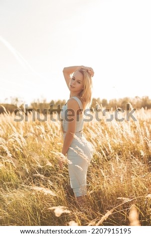 Similar – Young woman doing yoga in nature