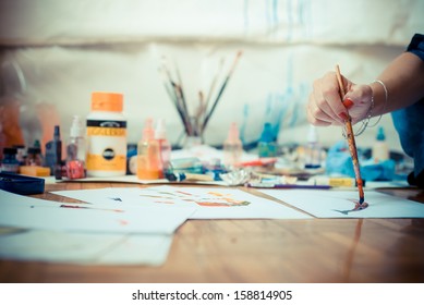 Beautiful Blonde Woman Painter In Her Studio