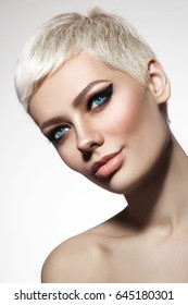 Beautiful Blonde Woman With Short Hair Cut And Stylish Winged Eye Make-up, Copy Space