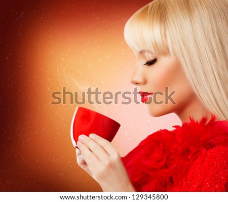 Beautiful blonde young woman with coffee