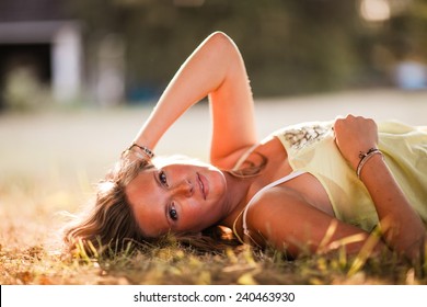 Beautiful Blonde Young Woman Laying Down In Shade Glowing Skin Variation Hand On Head