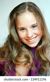A beautiful blond-haired 13-years old girl, portrait