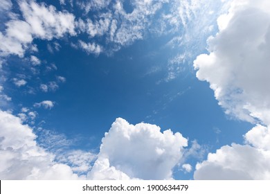 Beautiful blue clear sky with white cumulus clouds (cumulonimbus), bottom view, full frame, photography. - Shutterstock ID 1900634479
