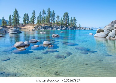 Beautiful blue clear water on the shore of the lake Tahoe - Powered by Shutterstock