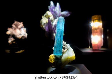 Beautiful blue gem with minerals at National Museum of Natural Science in Orlando Houston in USA, in a black background