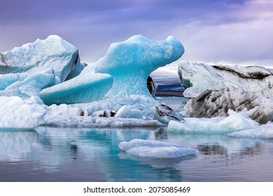 Beautiful blue icebergs reflected in the Jokulsarlon glacial lagoon, Southern Iceland. Part of the Vatnajokull National Park and Vatnajokull glacier, the largest glacier in Europe.
