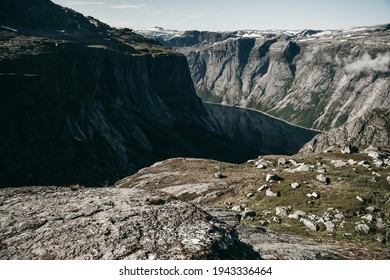 Beautiful Blue Landscape Of The Norwegian Fjord. Rocky Mountain Terrain, Deep Blue Lake, Water. Sunny Summer Day, Travel, Europe. No People, Fog. Trekking, Hiking, Unknown Wild Nature.